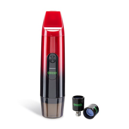 The Midnight Sun Ooze Booster Extract Vaporizer is shown with the cap attached to use it as a handheld vape. There are 2 extra Onyx Atomizers to the right.