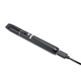 view of black Beacon dab pen being charged and lying down