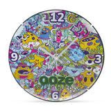 The Ooze Chroma Wall Clock is upright and facing straight-on. The white clock hands are set to 10:10