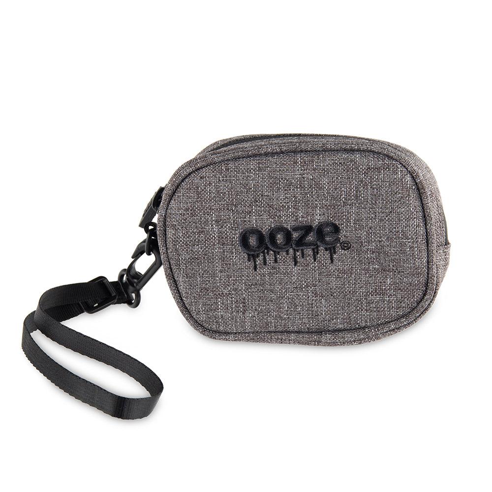 The smoke grey Ooze wristlet pouch is zipped up