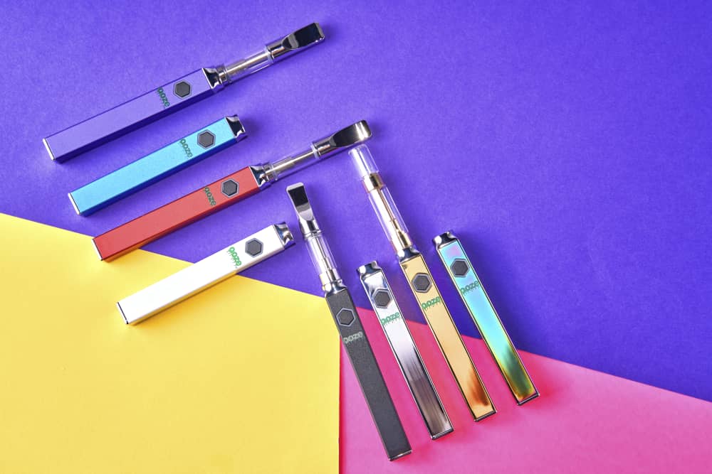 Different colors of Quad square vapes connected with different cartridges