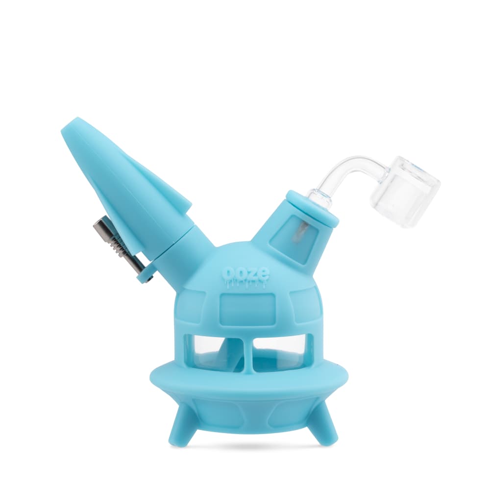 The aqua teal UFO is displayed as a dab rig with the banger inserted