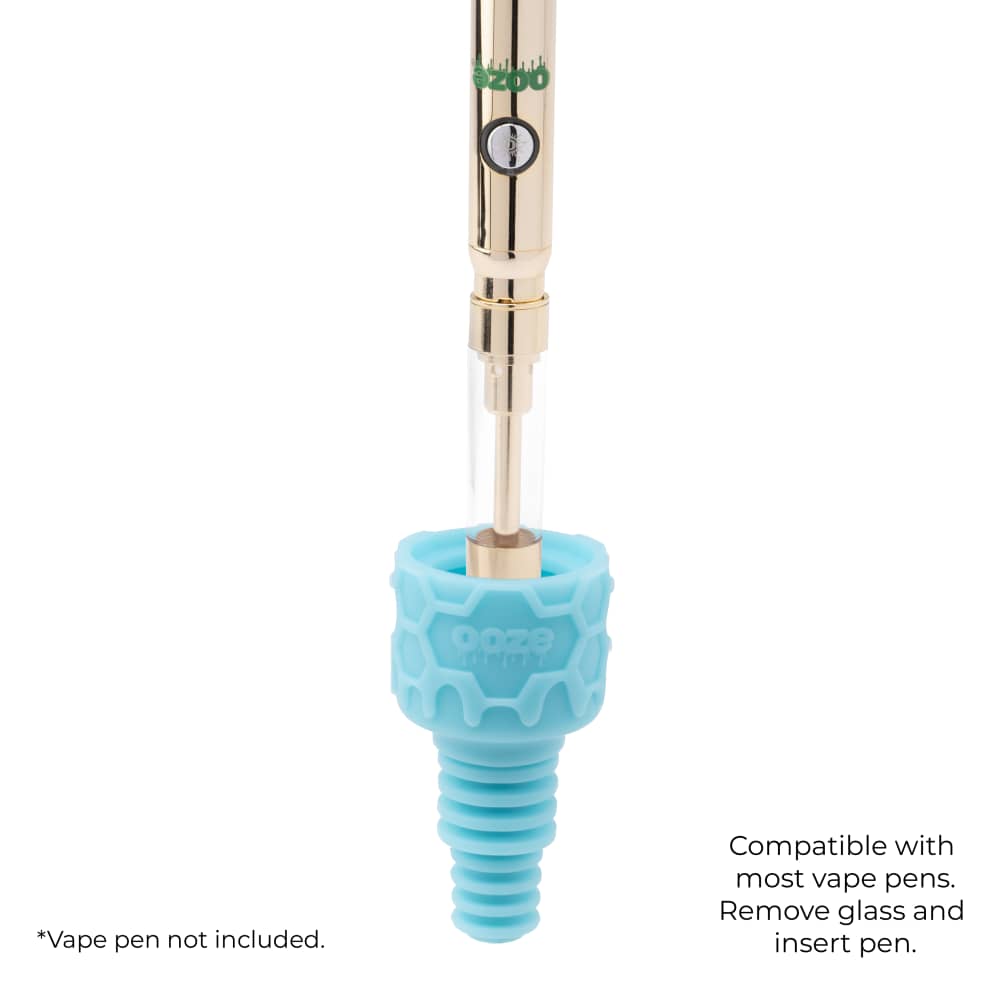 The aqua teal Ooze UFO's silicone armor bowl is shown with a gold vape pen inserted into it to show the vape adapter function