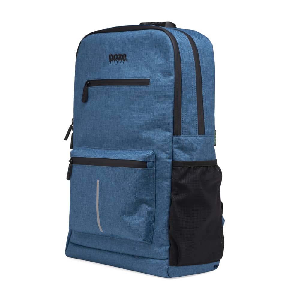 The surf blue Ooze backpack is zipped up with the side pocket showing