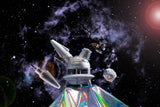 The stellar silver Ooze UFO is shown as a dab rig against a galaxy background with the dab straw and matching stash jar nearby