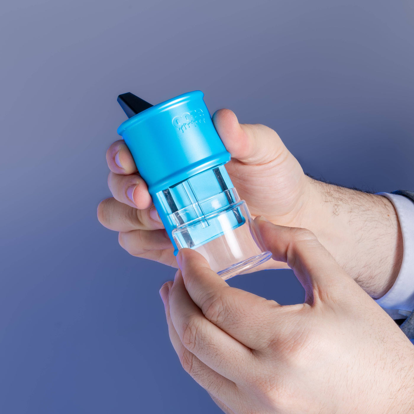 person taking apart blue Electro Barrel electric dab rig