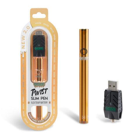 Orange Twist Slim 2.0 Vape Pen Battery inside box with 510 thread battery USB charger attached with additional vape pen battery outside the box