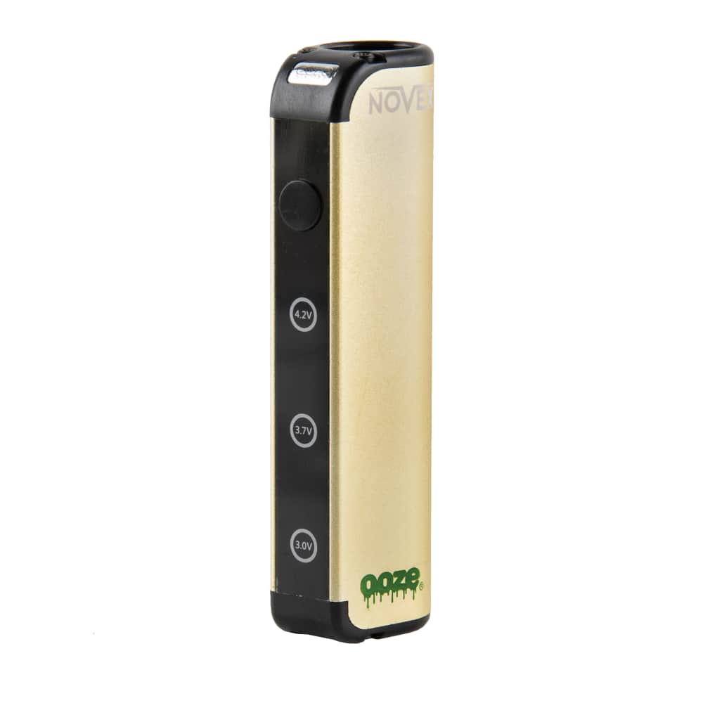 The lucky gold Ooze Novex stands on an angle to show the button